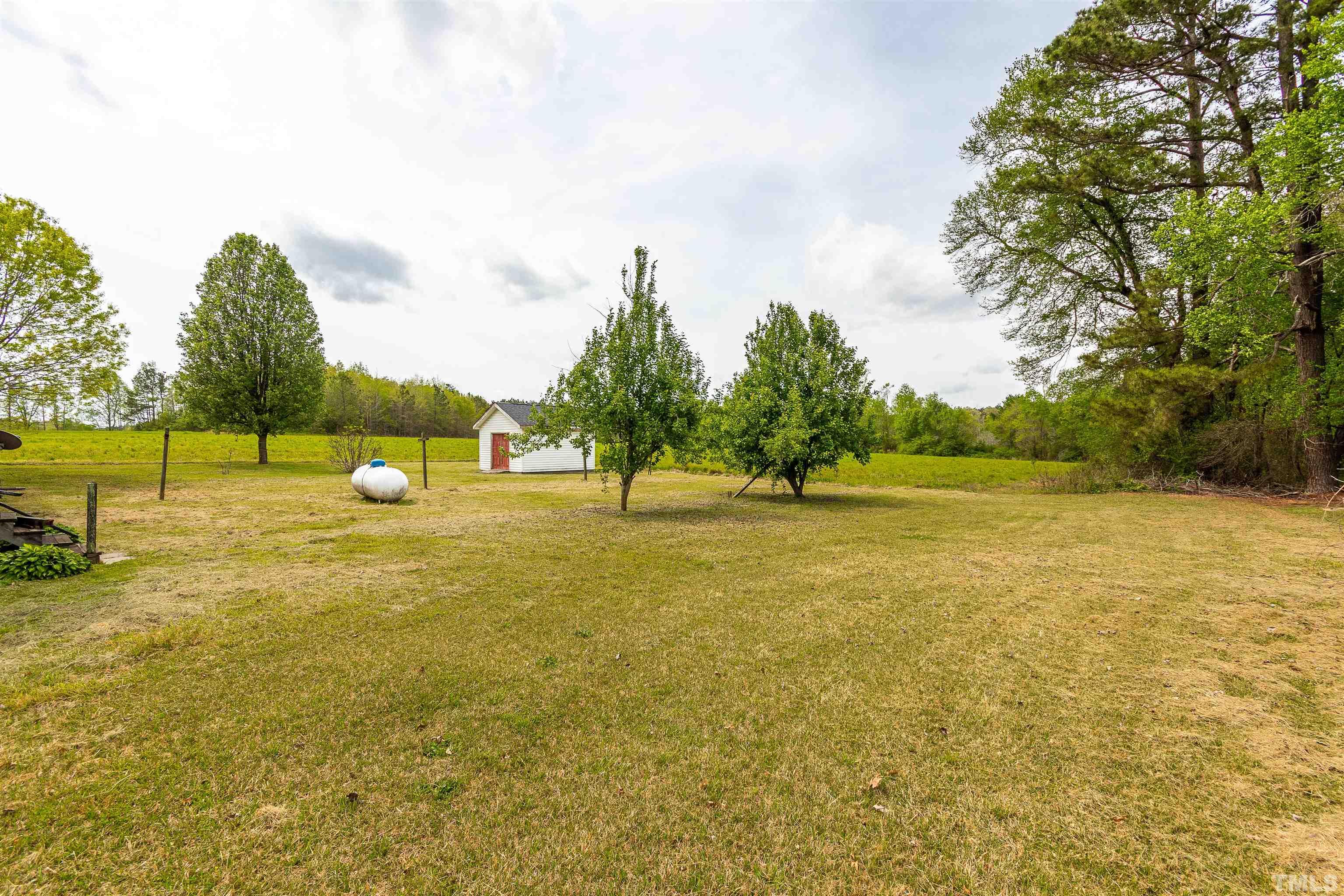2656 Prophecy Road Middlesex, NC 27557 - Photo 25 of 26 a view of yard with swimming pool and trees