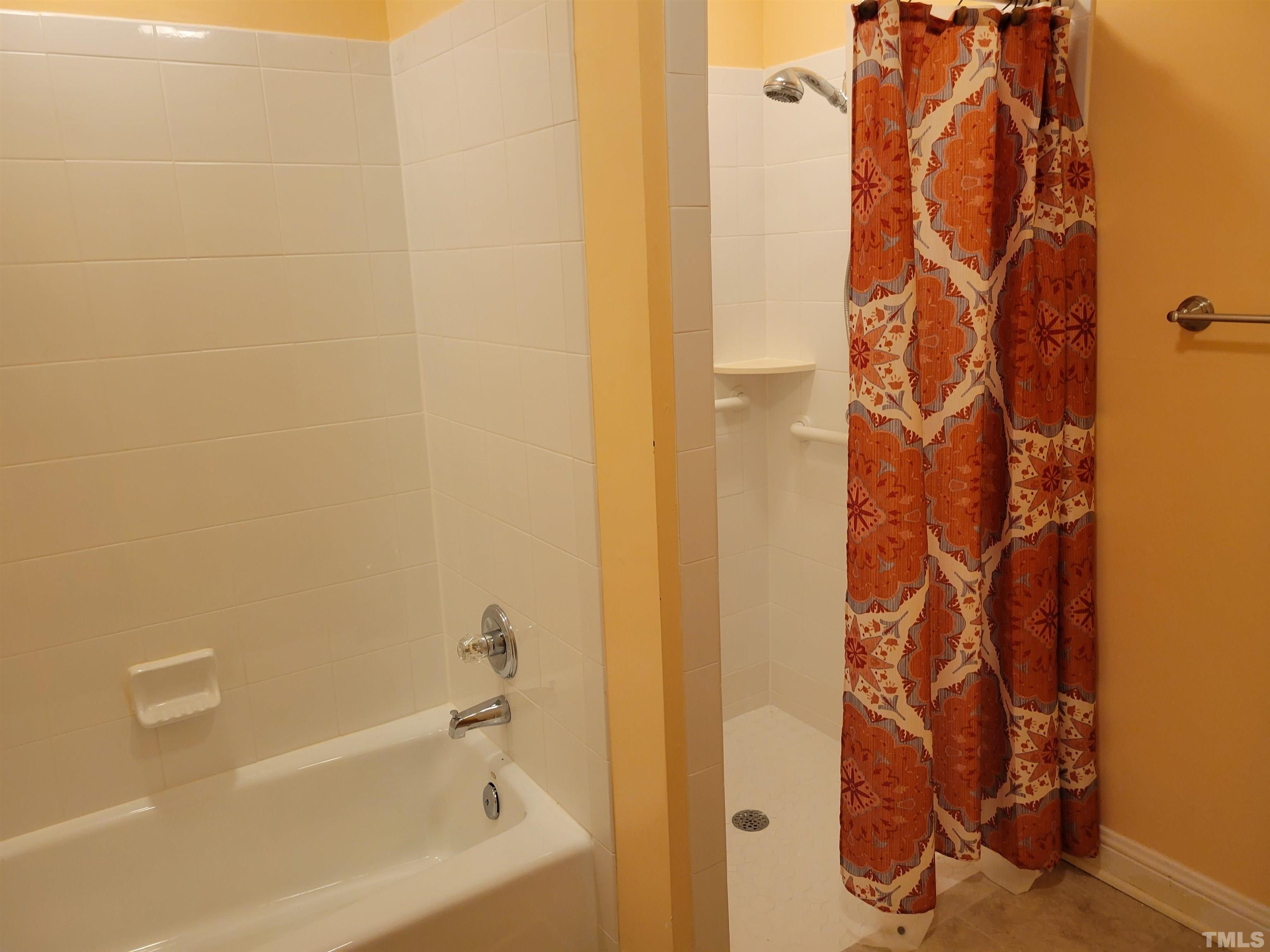 2656 Prophecy Road Middlesex, NC 27557 - Photo 8 of 26 a bathroom with a bathtub and shower