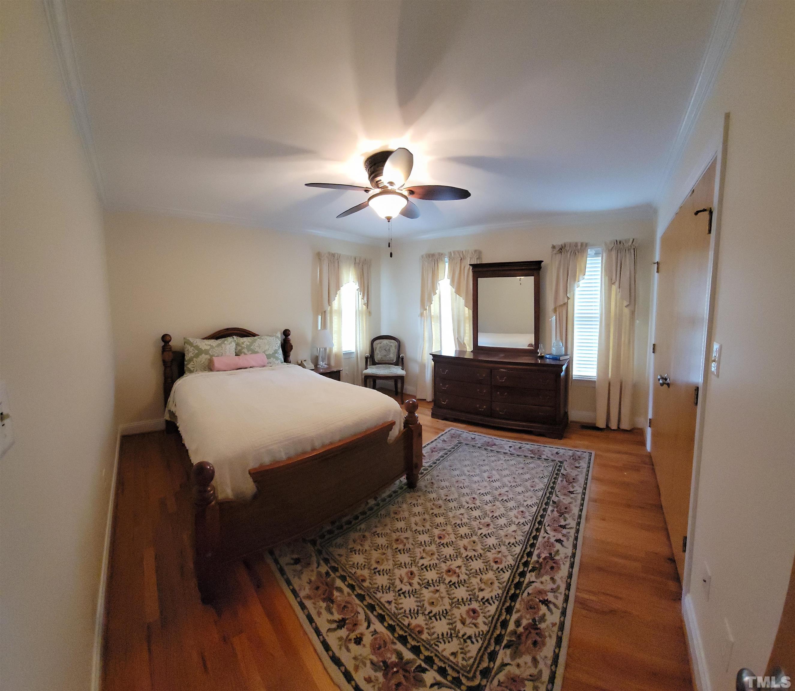 2656 Prophecy Road Middlesex, NC 27557 - Photo 9 of 26 a bed room with a bed and a chandelier