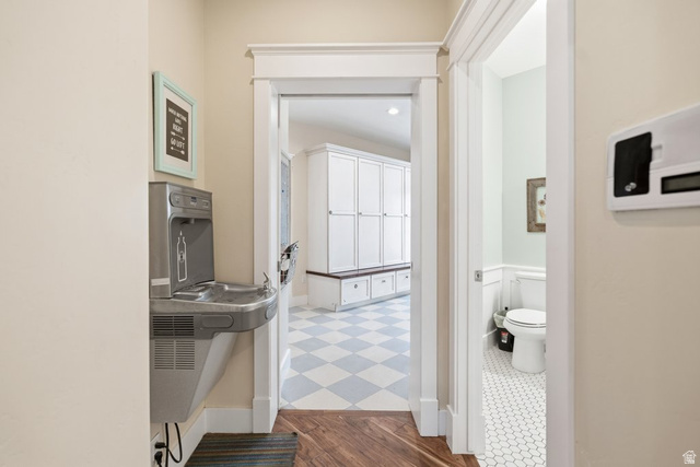 672 Perry Hollow Drive Mapleton, UT 84664 - Photo 63 of 106 mud room, featuring a water fountain, wood-finish flooring, and crown molding
