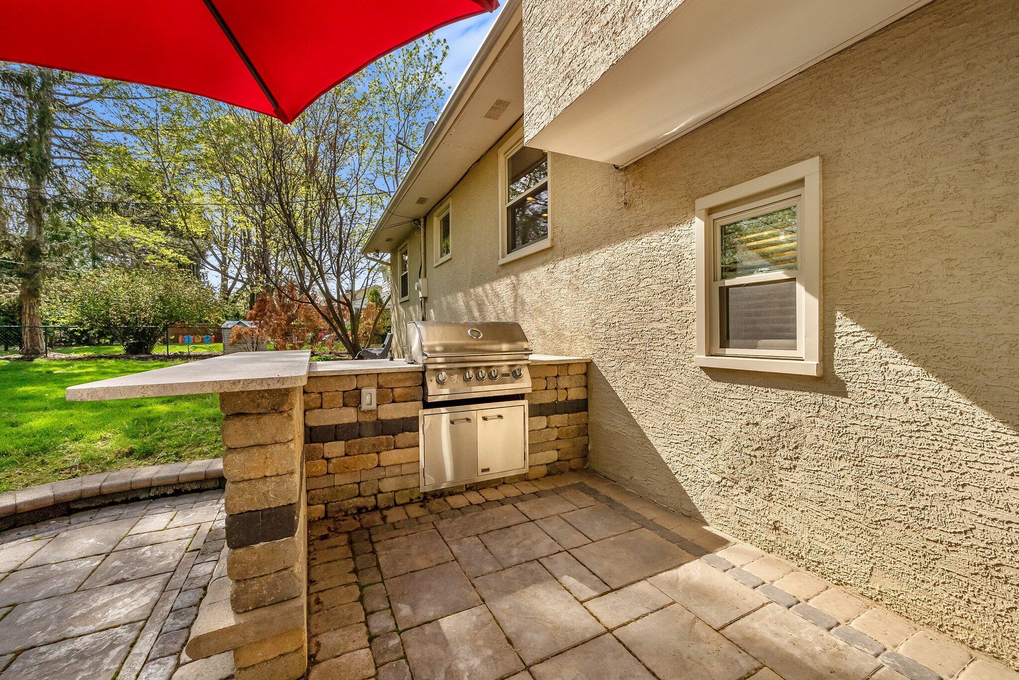 1269 Windham Road Columbus, OH 43220 - Photo 66 of 82 Move in just in time to enjoy spring and summer nights on this relaxing patio complete w/ granite island, built-in grill & firepit.