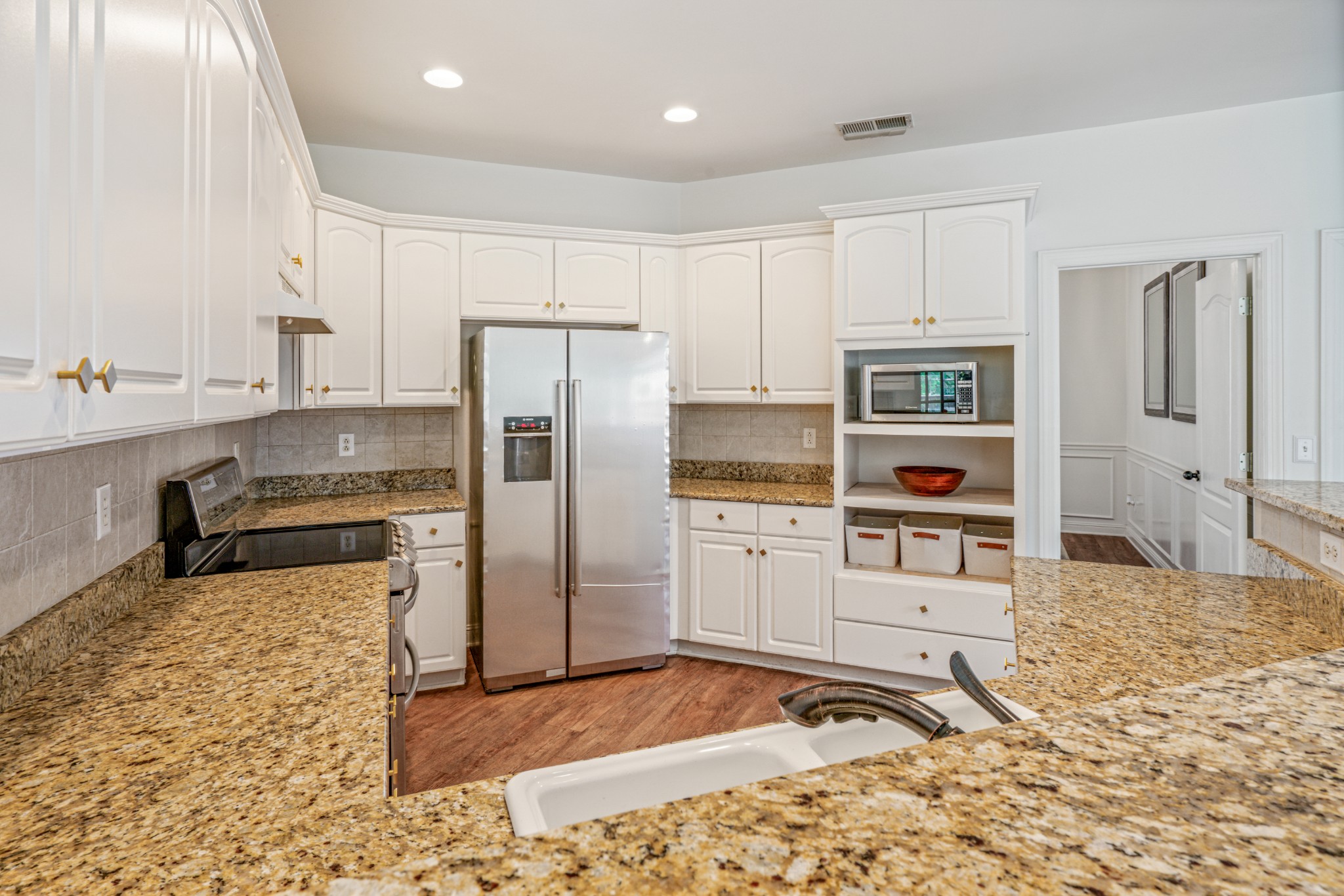 532 Bancroft Way Franklin, TN 37064 - Photo 16 of 48 a kitchen with stainless steel appliances kitchen island granite countertop a refrigerator and a sink