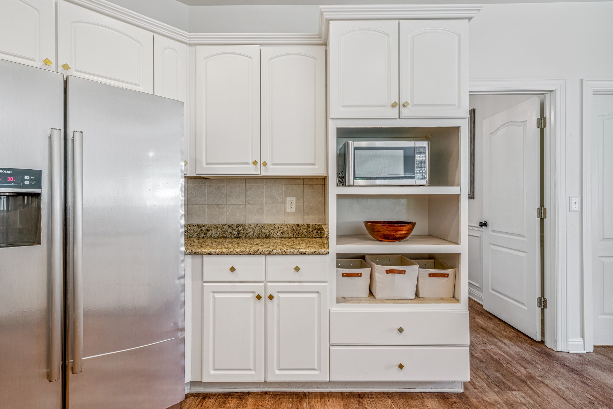 532 Bancroft Way Franklin, TN 37064 - Photo 18 of 48 a kitchen with stainless steel appliances granite countertop a refrigerator and a stove