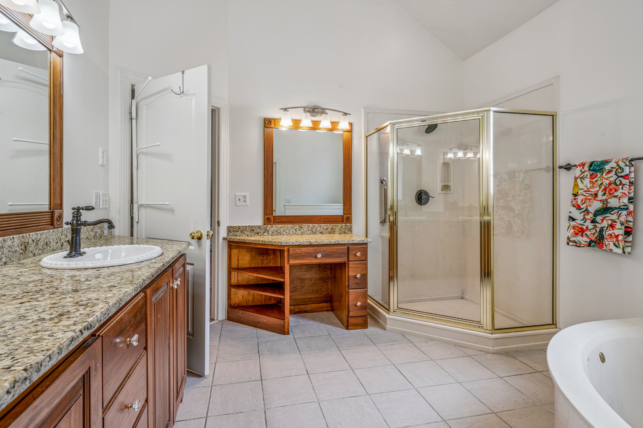 532 Bancroft Way Franklin, TN 37064 - Photo 22 of 48 a bathroom with a granite countertop sink a mirror and a shower