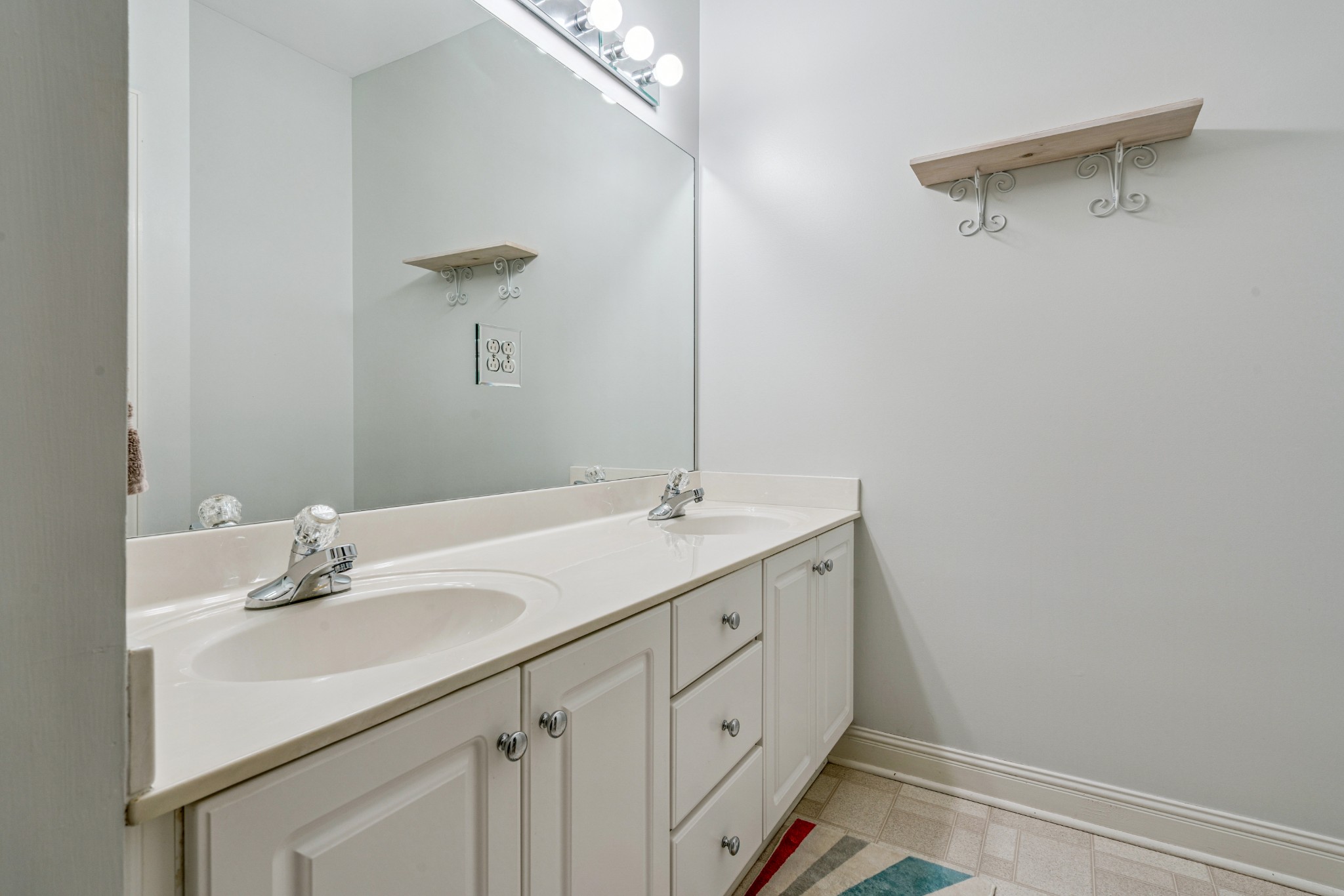 532 Bancroft Way Franklin, TN 37064 - Photo 28 of 48 a bathroom with a sink and a mirror