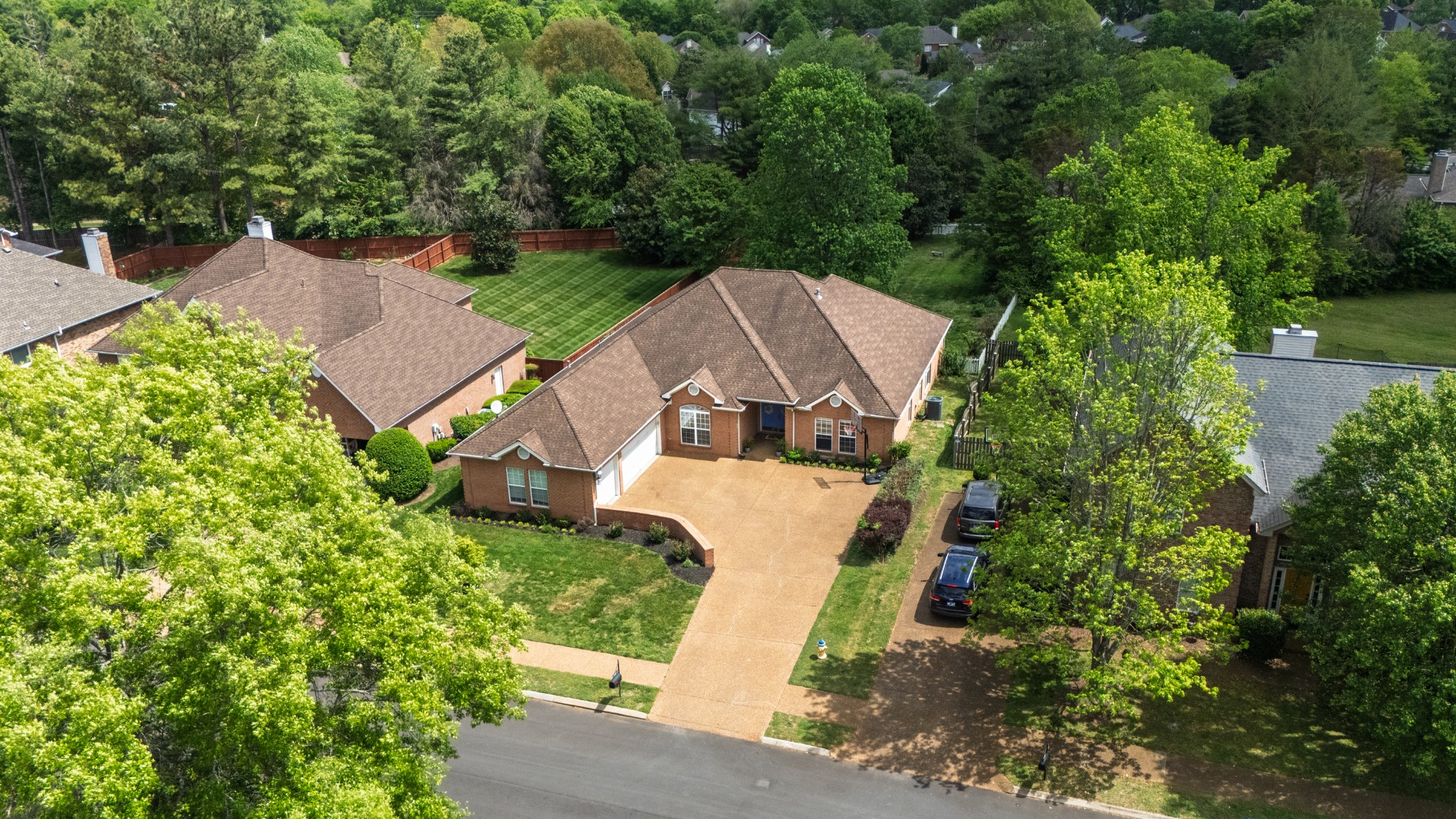 532 Bancroft Way Franklin, TN 37064 - Photo 33 of 48 an aerial view of a house with a yard and large trees
