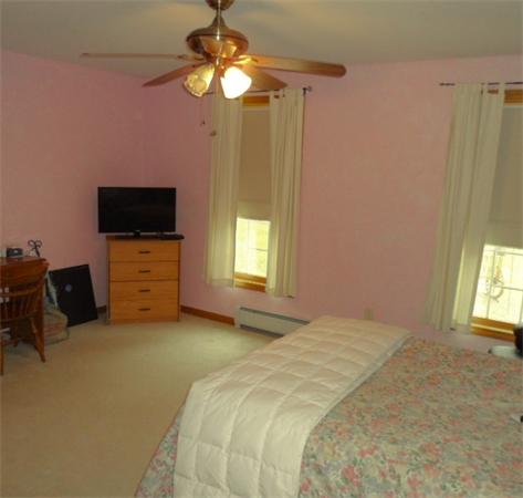 491 Petersham Road Athol, MA 01331 - Photo 11 of 22 a bedroom with a bed and a flat tv screen on dresser