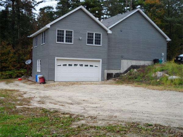 491 Petersham Road Athol, MA 01331 - Photo 19 of 22 a view of a house with a yard and garage