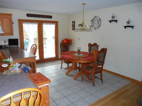 491 Petersham Road Athol, MA 01331 - Photo 5 of 22 a dining room with furniture a rug and a chandelier