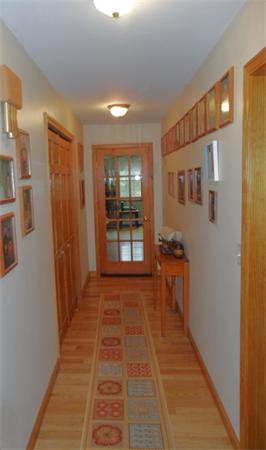 491 Petersham Road Athol, MA 01331 - Photo 8 of 22 a view of a hallway with wooden shelves