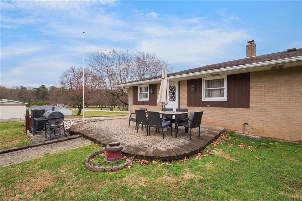 221 Story Road Export, PA 15632 - Photo 6 of 30 a view of a house with backyard porch and sitting area