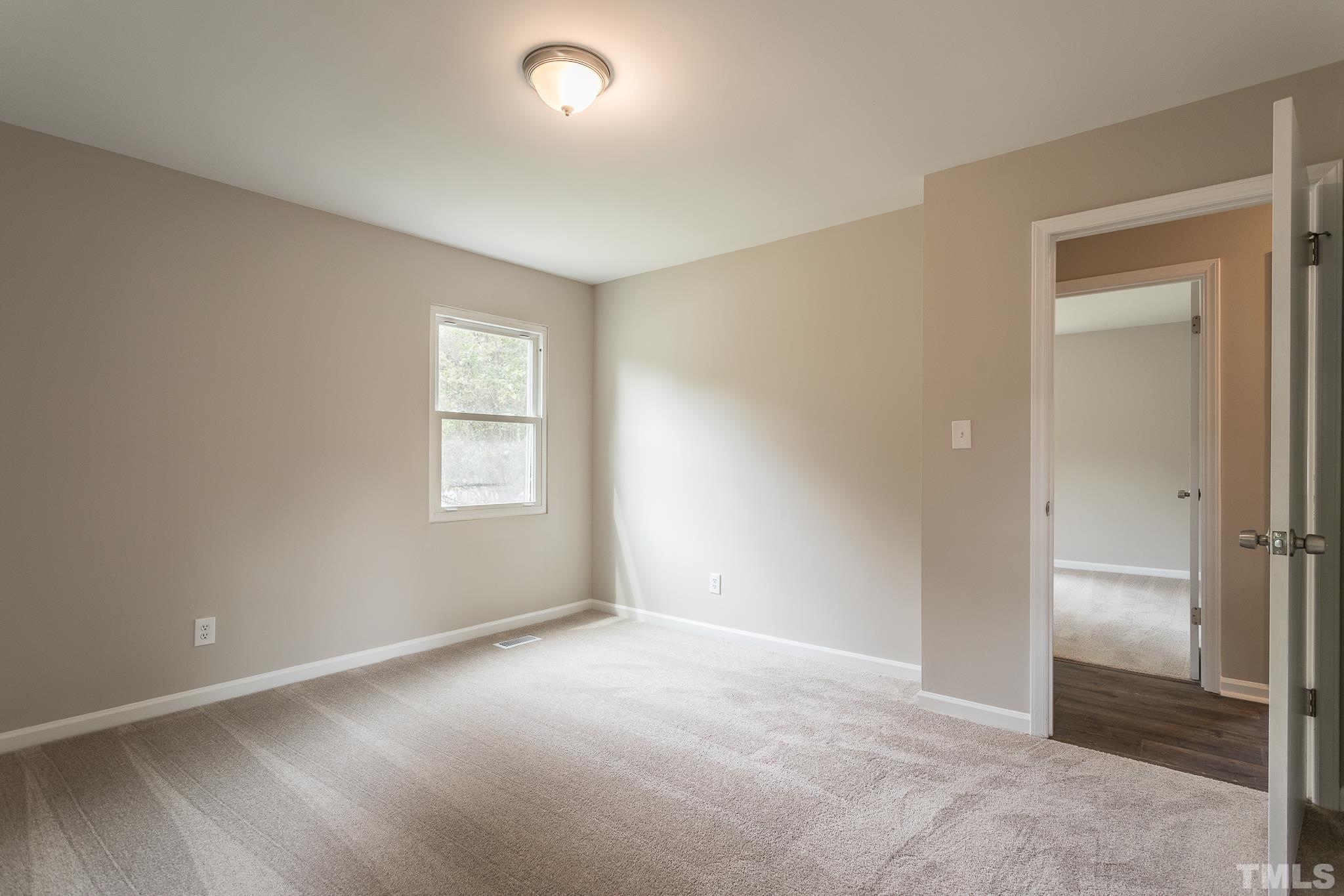 4000 Wheaton Road Durham, NC 27704 - Photo 12 of 21 an empty room with windows and closet