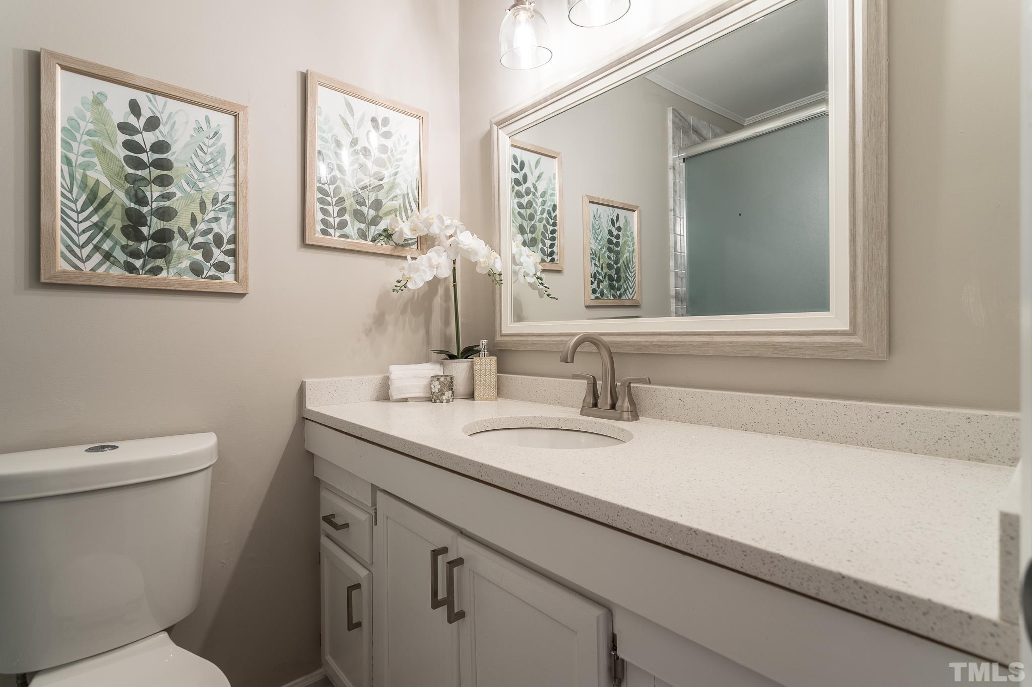 4000 Wheaton Road Durham, NC 27704 - Photo 16 of 21 a bathroom with a granite countertop sink mirror and toilet