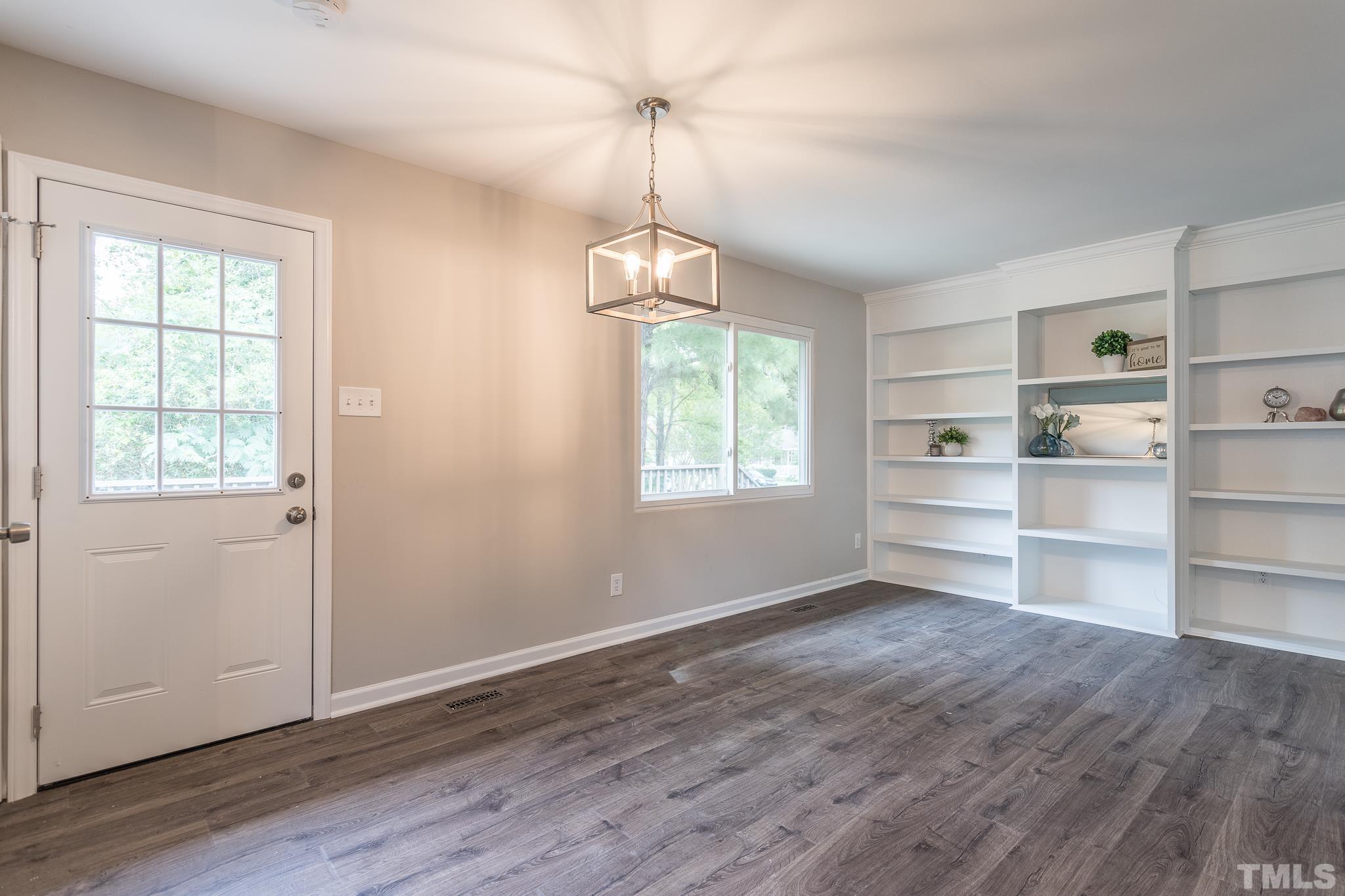 4000 Wheaton Road Durham, NC 27704 - Photo 6 of 21 a view of a room with a window and wooden floor
