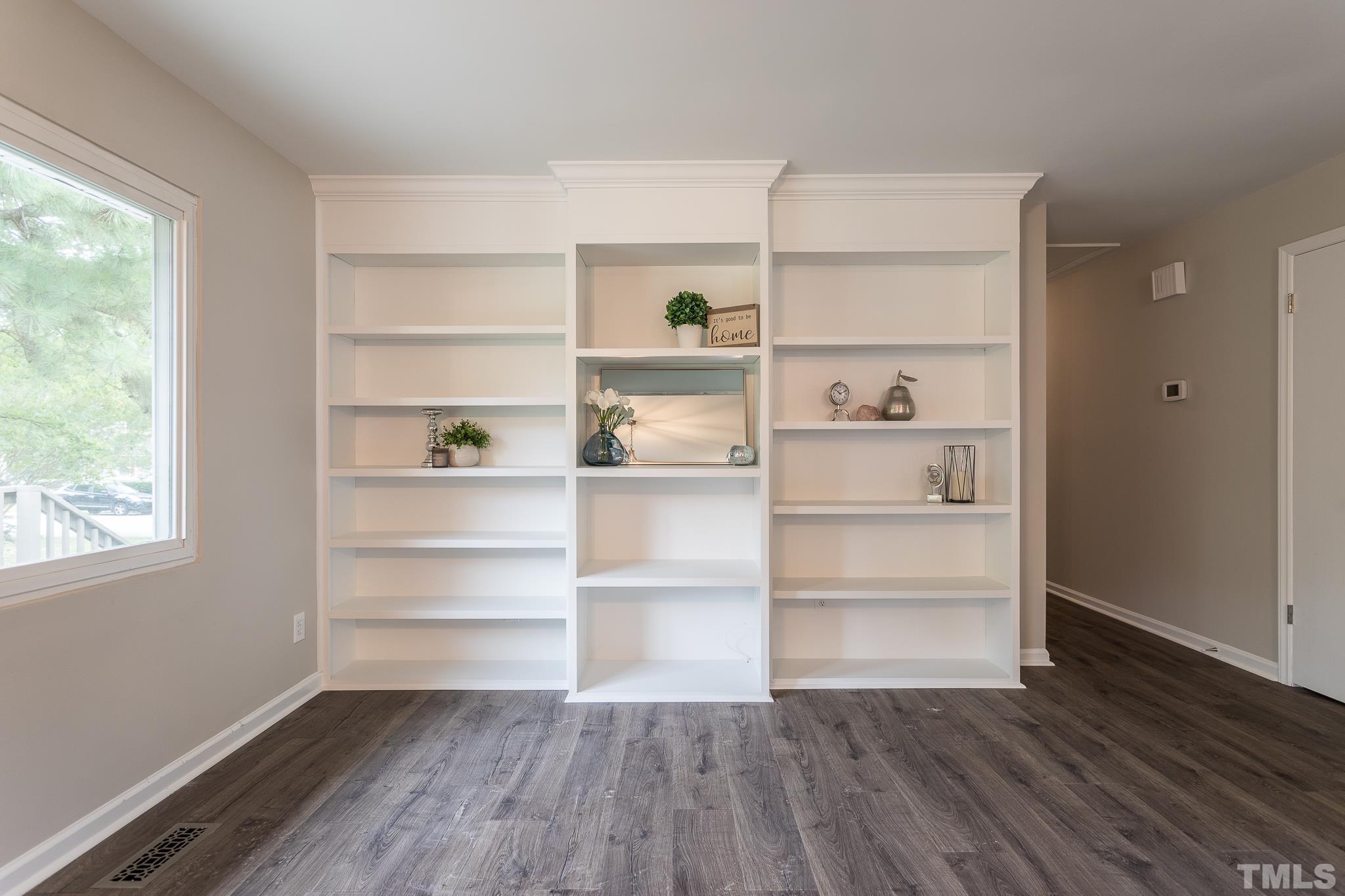 4000 Wheaton Road Durham, NC 27704 - Photo 10 of 21 a room with walk in closet and wooden floor