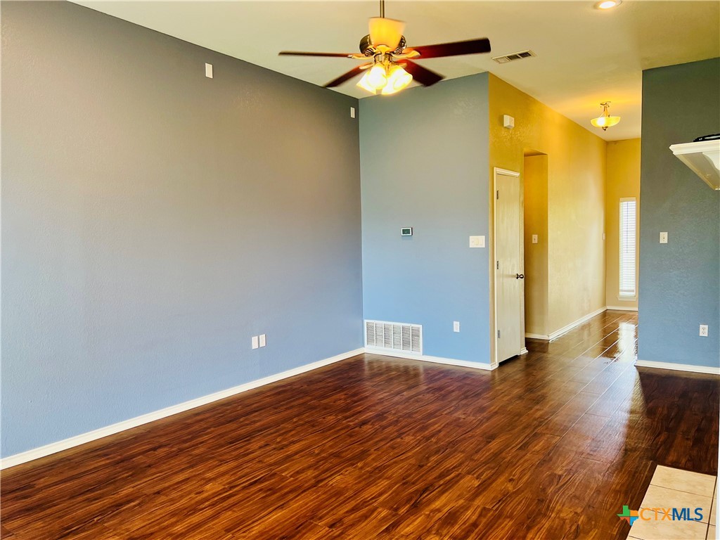 8210 Sunset Trail Temple, TX 76502 - Photo 5 of 15 a view of a big room with wooden floor and a bathroom