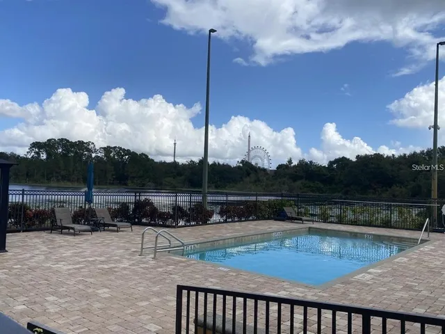 a view of a swimming pool with a patio