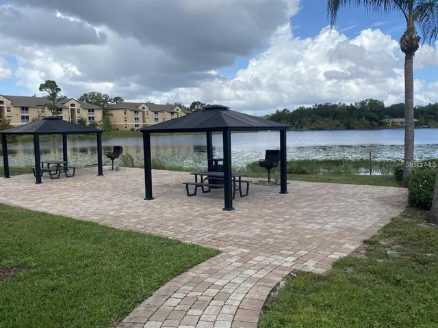 a view of a patio with a table and chairs
