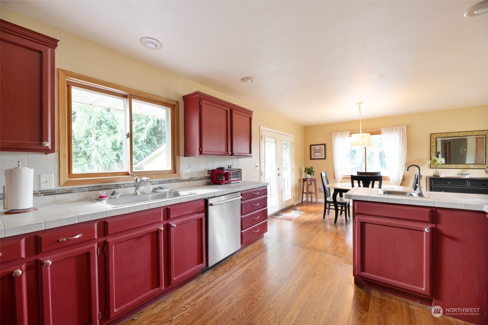 973 Koontz Road Chehalis, WA 98532 - Photo 11 of 25 a kitchen with a sink stove cabinets and wooden floor