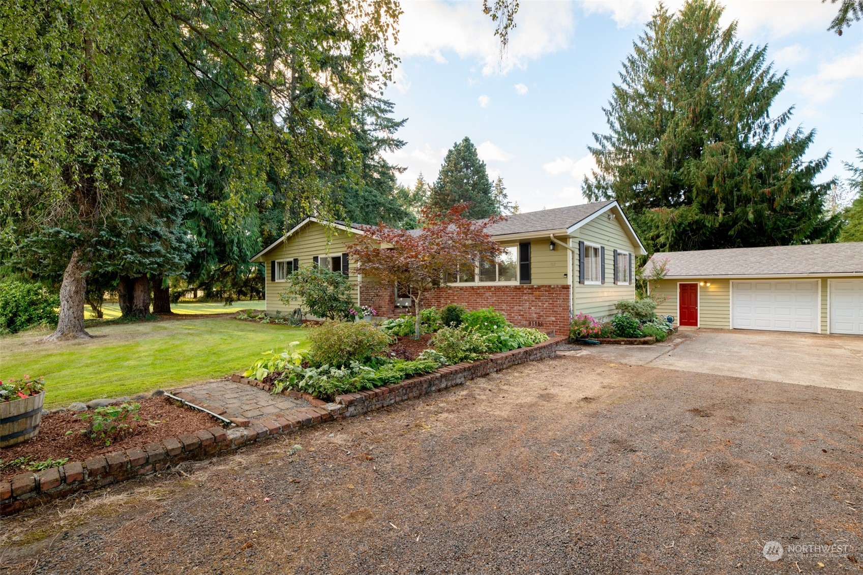 973 Koontz Road Chehalis, WA 98532 - Photo 3 of 25 a house with huge green field in front of it