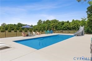 8258 Mt Eagle Road Ashland, VA 23005 - Photo 2 of 14 a view of swimming pool with a yard and lake view