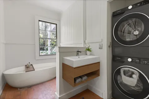 a bathroom with a sink a toilet and a bathtub