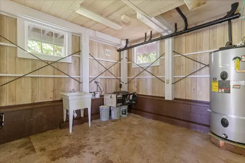 a backyard of a house with table and chairs