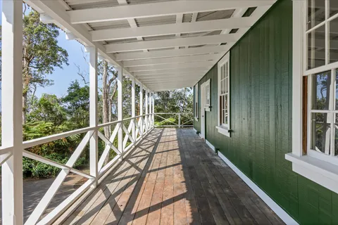 a view of balcony with wooden floor and door