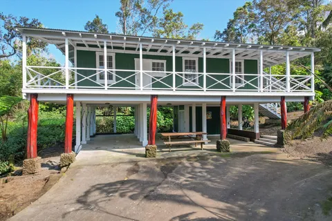 a view of a building with a window and plants