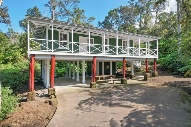 a front view of a building with outdoor seating