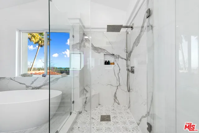 a bathroom with a sink and a shower