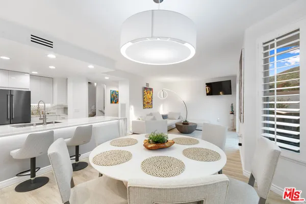 a dining room with furniture and window