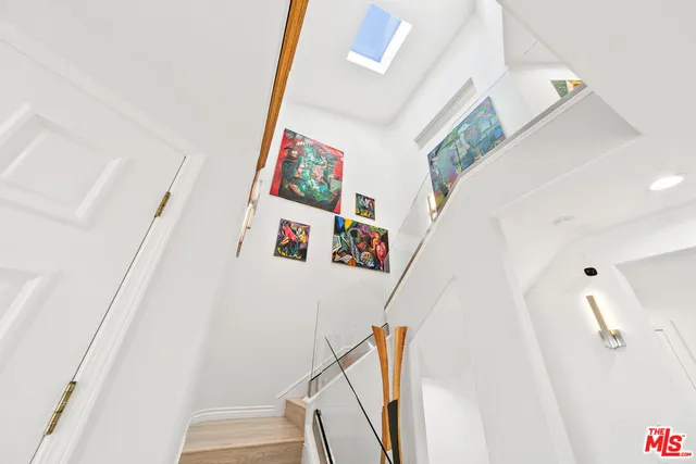 a view of entryway with furniture and wooden floor