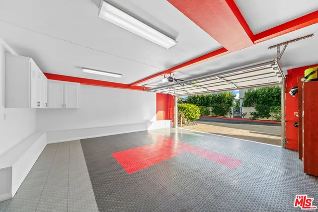 a view of a swimming pool with a table and chairs