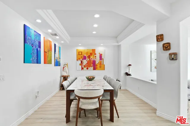 a dinning room with furniture and window