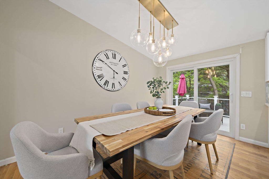 68 Dothan Street Arlington, MA 02474 - Photo 11 of 36 a dining room with furniture a chandelier and a rug