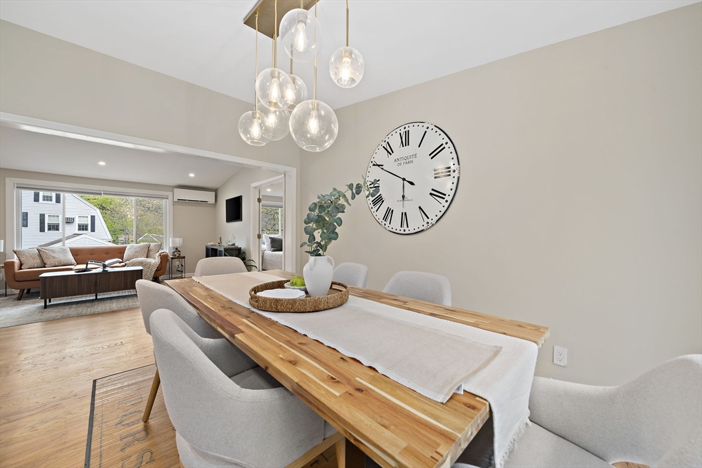 68 Dothan Street Arlington, MA 02474 - Photo 12 of 36 a living room with furniture a clock and a window
