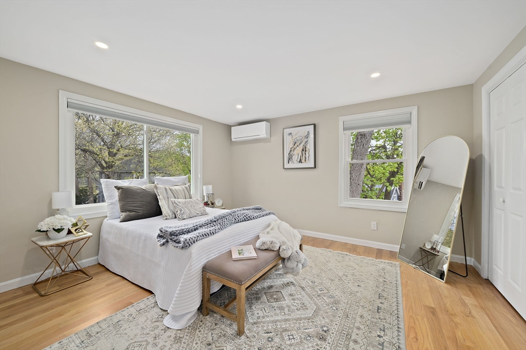 68 Dothan Street Arlington, MA 02474 - Photo 14 of 36 a bedroom with a bed and a window