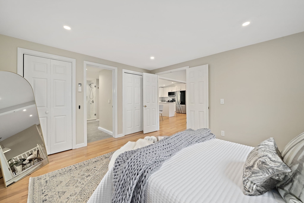 68 Dothan Street Arlington, MA 02474 - Photo 15 of 36 a bedroom with a bed and a mirror