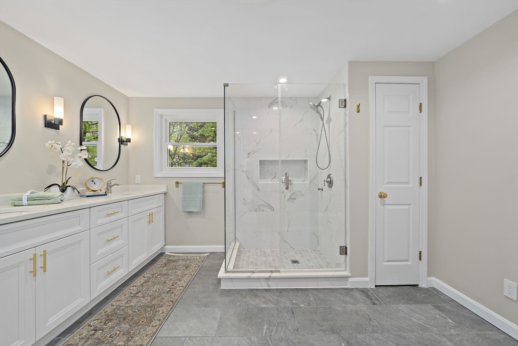 68 Dothan Street Arlington, MA 02474 - Photo 16 of 36 a spacious bathroom with a mirror a sink and a shower