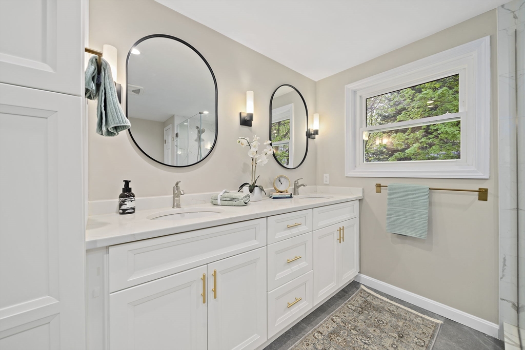 68 Dothan Street Arlington, MA 02474 - Photo 17 of 36 a bathroom with a double vanity sink and a window