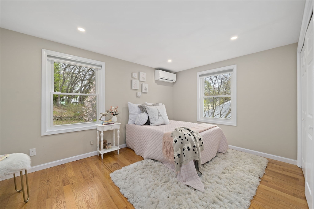 68 Dothan Street Arlington, MA 02474 - Photo 18 of 36 a bedroom with a bed and a window