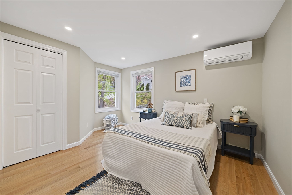 68 Dothan Street Arlington, MA 02474 - Photo 20 of 36 a bedroom with a bed and a dresser
