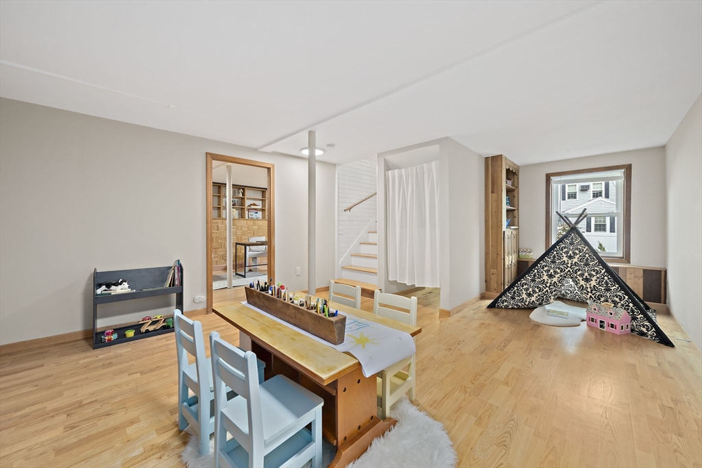 68 Dothan Street Arlington, MA 02474 - Photo 25 of 36 a living room with a bed furniture and a window
