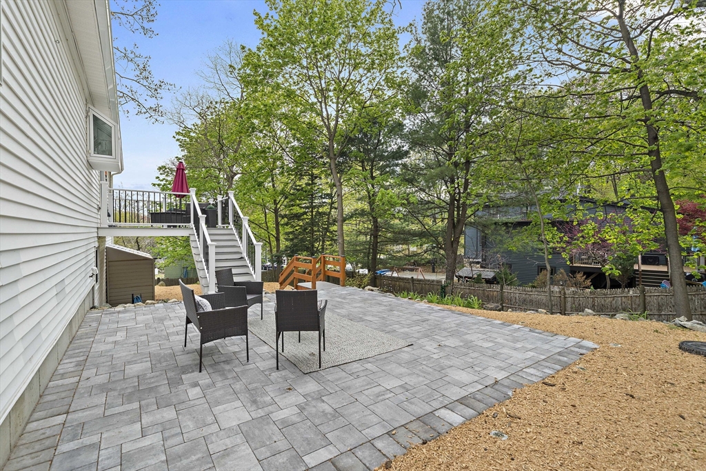 68 Dothan Street Arlington, MA 02474 - Photo 28 of 36 a view of a patio with table and chairs and potted plants