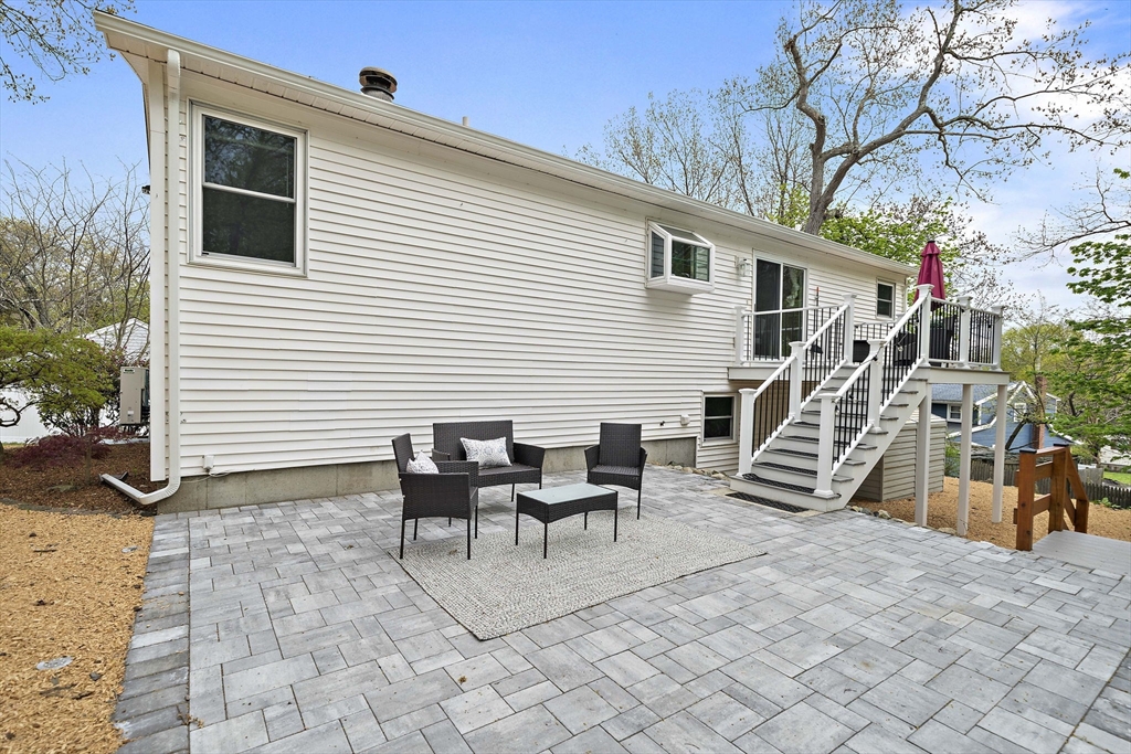 68 Dothan Street Arlington, MA 02474 - Photo 29 of 36 a view of a patio with chairs and potted plants