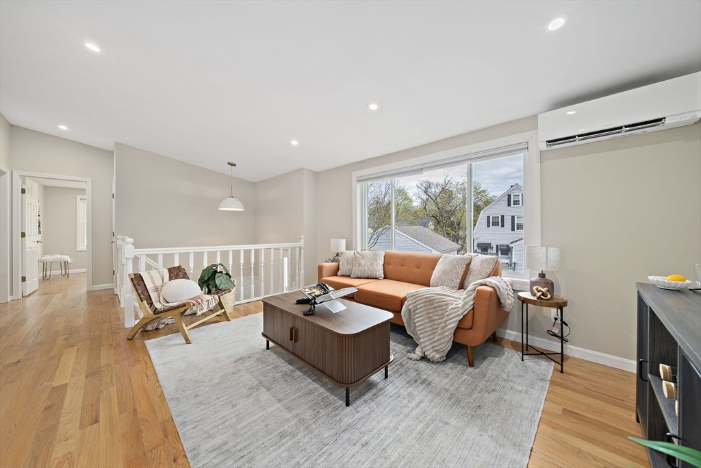 68 Dothan Street Arlington, MA 02474 - Photo 3 of 36 a living room with furniture and a large window