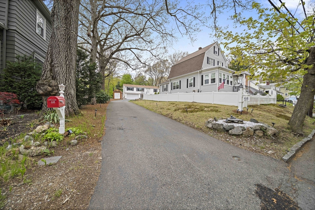 68 Dothan Street Arlington, MA 02474 - Photo 33 of 36 a front view of a house with a yard