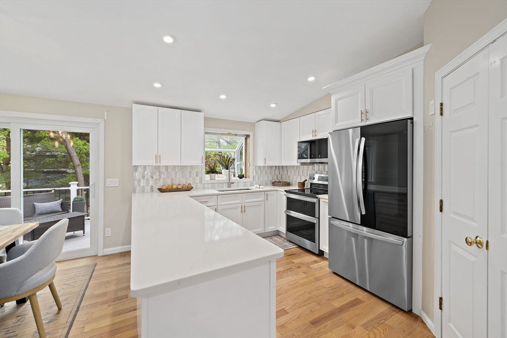 68 Dothan Street Arlington, MA 02474 - Photo 7 of 36 a kitchen with refrigerator a stove and a refrigerator