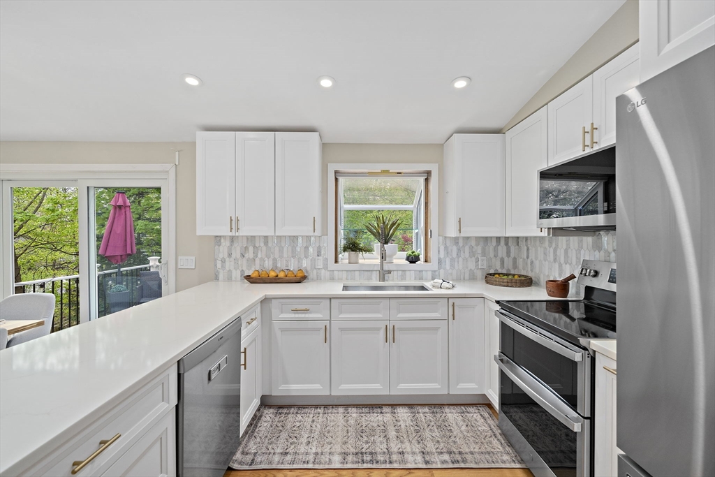 68 Dothan Street Arlington, MA 02474 - Photo 8 of 36 a kitchen that has a sink and a stove in it